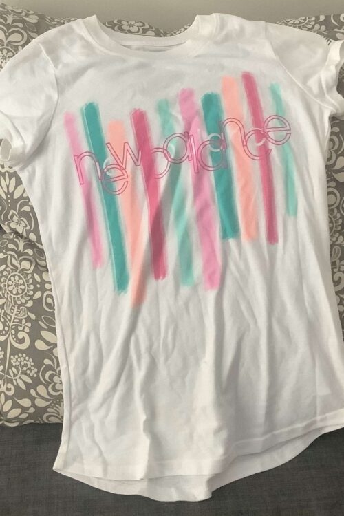 New balance white with pink, peach and cyan stripes T shirt. For girls/filles/ninas